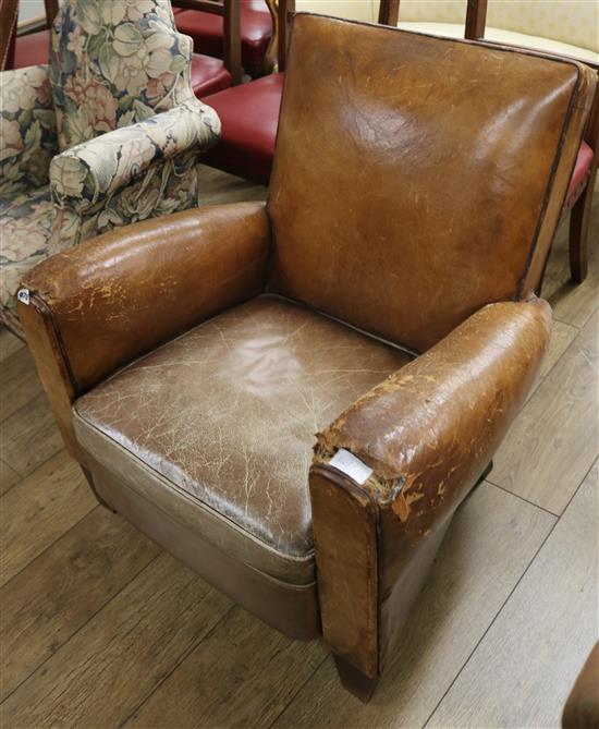 A vintage leather club armchair